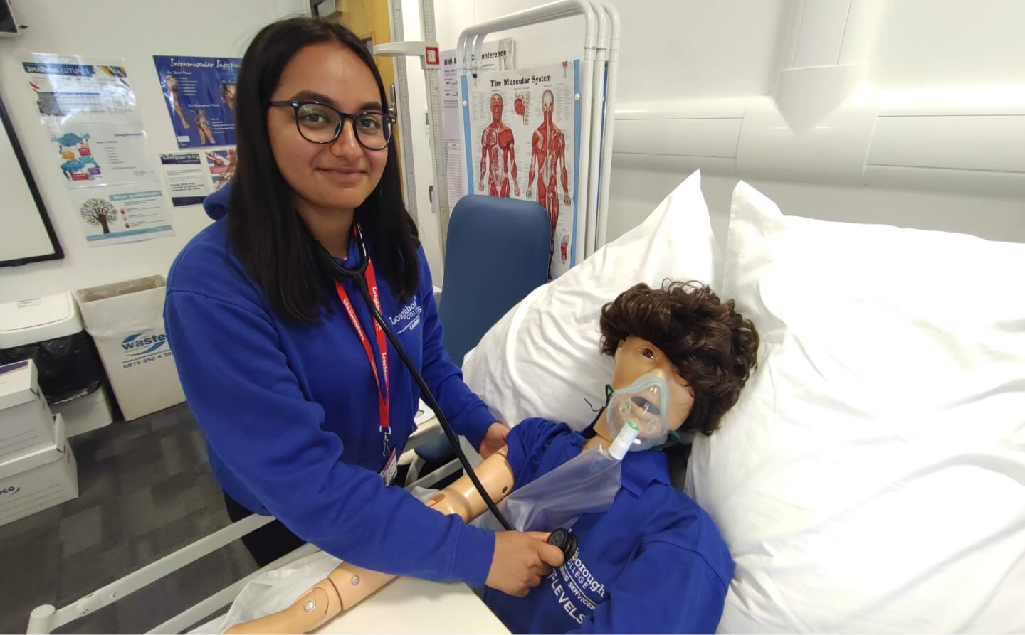 Radhika Raithatha T-Level in Healthcare student attending to a CPR dummy in a hospital bed