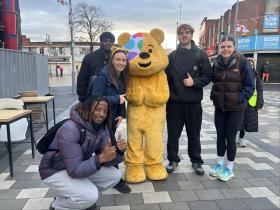 Sports Exercise and Therapy students and lecturer with Pudsey Bear