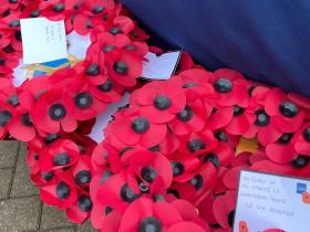 Two red poppy wreaths