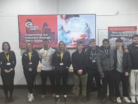 Students stand with the EIC Members