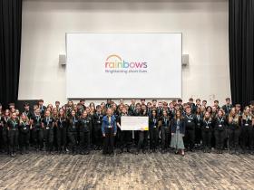 Students present Rainbows with a cheque