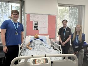 Jack, Teagen, and Lilly in the Heath and Social Care room