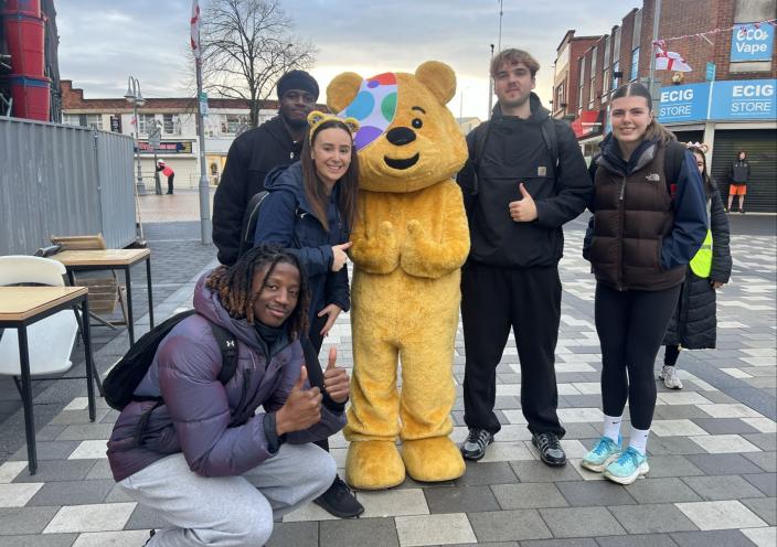 Sports Exercise and Therapy students and lecturer with Pudsey Bear