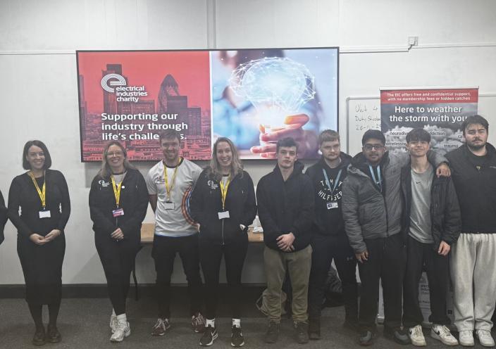 Students stand with the EIC Members