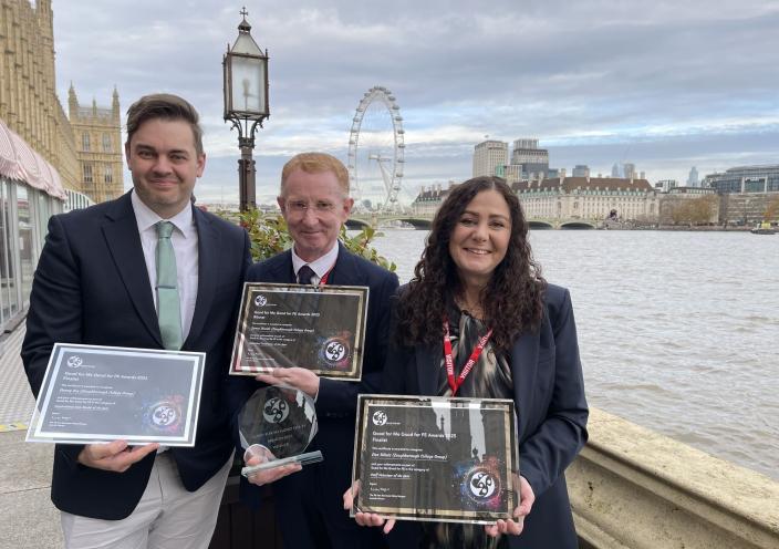The three nominees stand with their certificates in front of the river Thames.