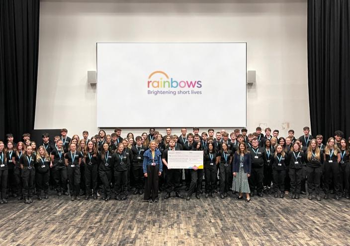 Students present Rainbows with a cheque