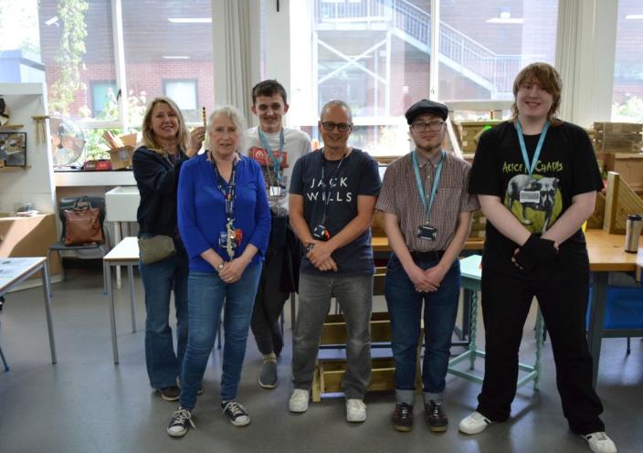 Staff and students at the plant and woodworking sale