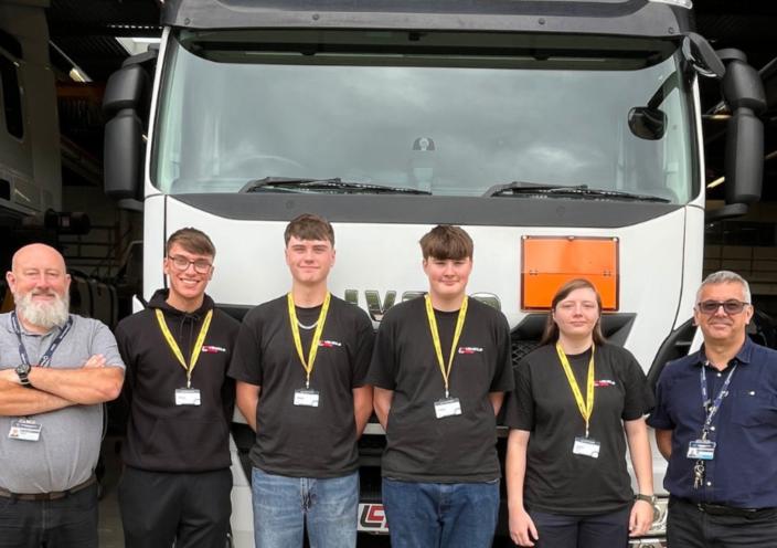 Staff and students in front of the HGV truck 