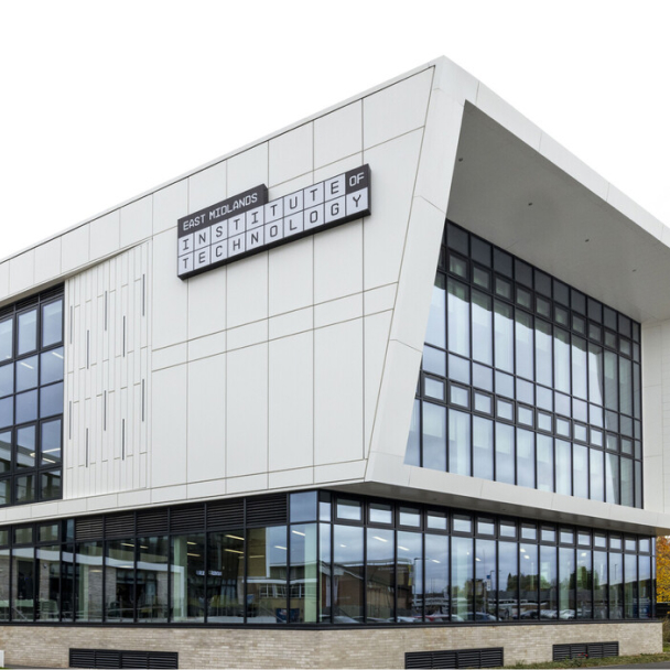 Exterior of the East Midlands Institute of Technology building, a tall white building with large glass windows and an angled front
