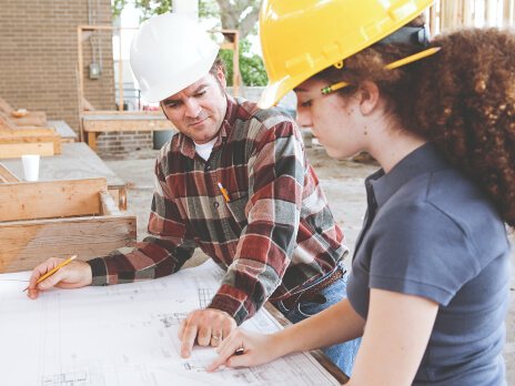 Employees sitting around a table having a meeting