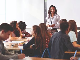 Teacher standing in front of a class of students