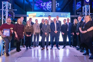 All winners from the 2026 Apprenticeship Awards standing on stage with Jonny Watkin, Stephenson Principle, and Jenny Dryden, Stephenson Assistant Principal