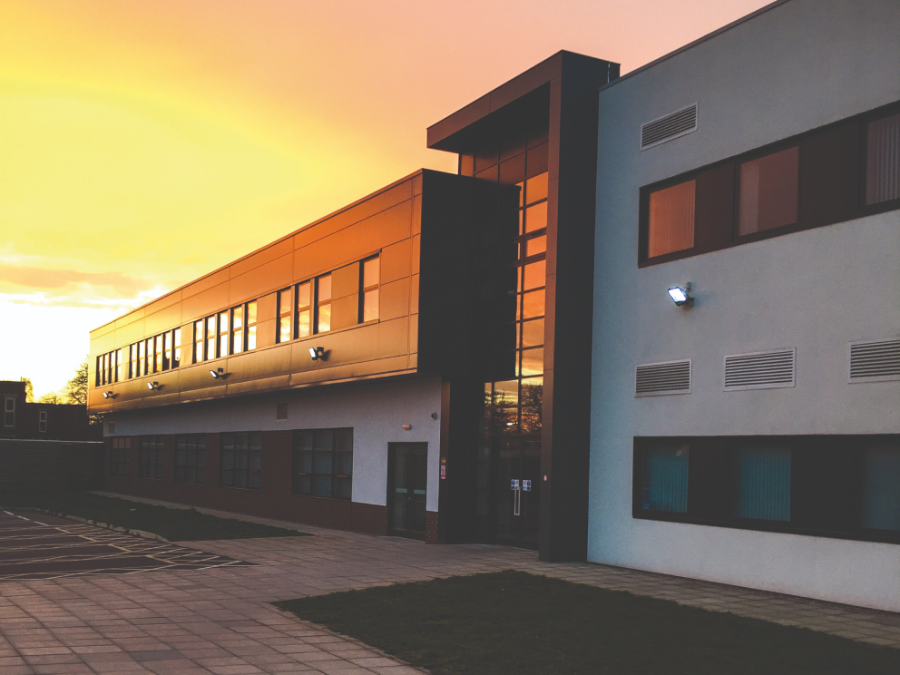 Sunset over a building at IGNITE