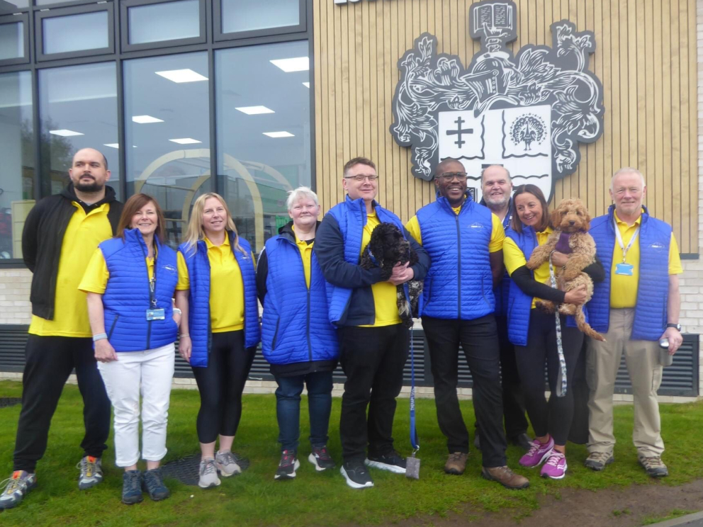 Support staff member using a headset to answer a phone call