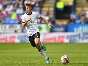 George Thomason Bolton Wonderers Captain making a pass in a game