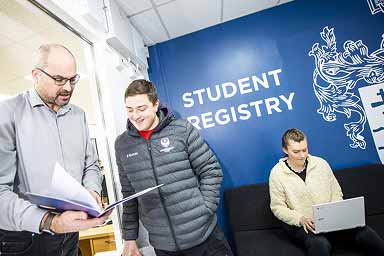 Student talking to a member of the Degree Higher Education team