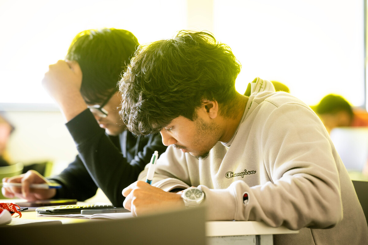 Students making notes in class