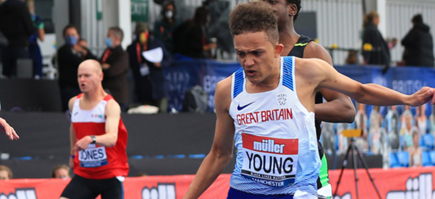 A track athelete finishing a race.