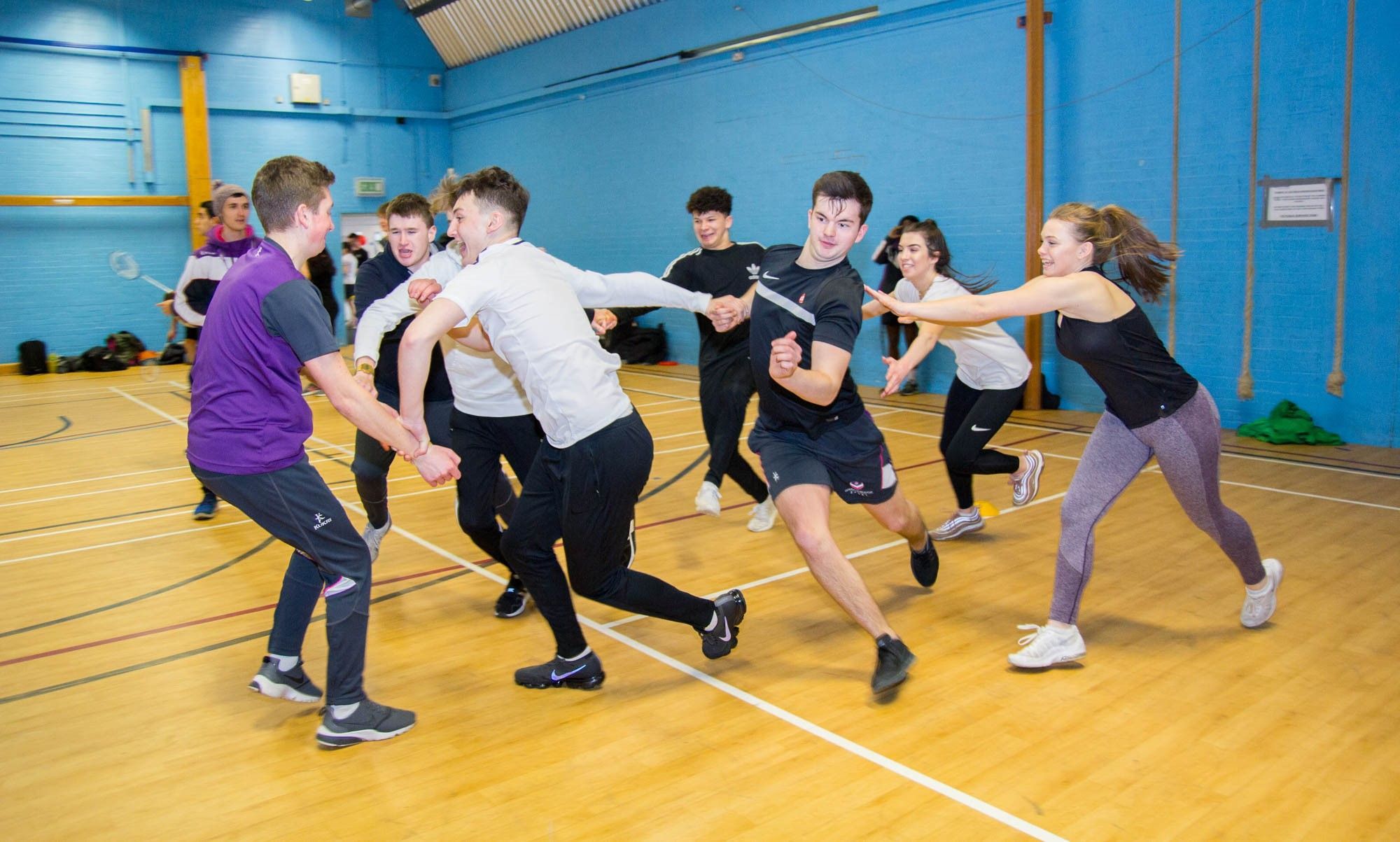 A group of students playing a recreational sport.