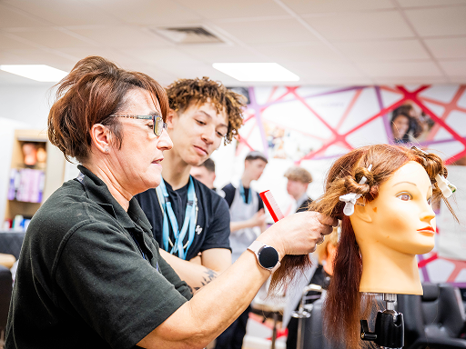 Person Styling the Hair of a training head